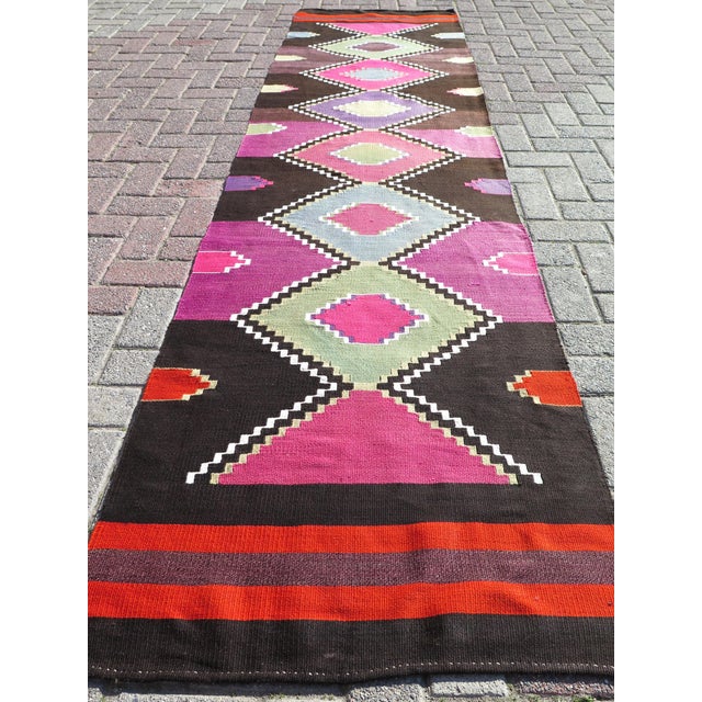 The Runner Rug you are about to purchase is a Vintage Handmade Turkish Rug that is considered a collection piece due to...