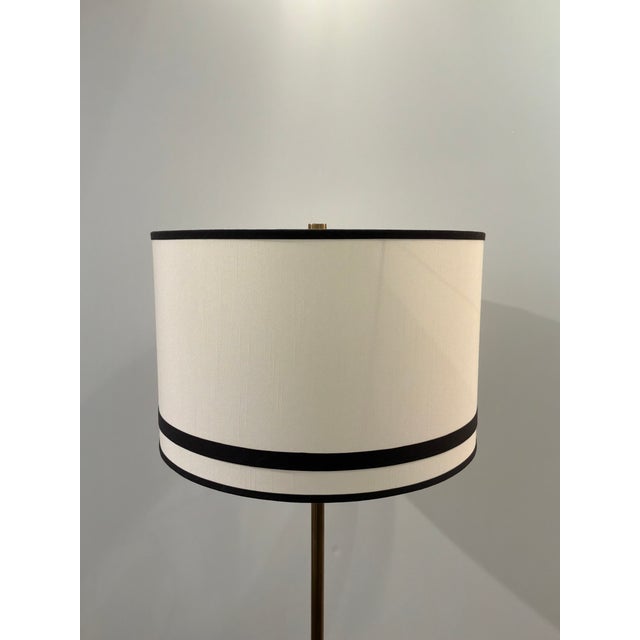 Modern stylish Currey & Co. Gieves Floor Lamp. Black banded shade with black base and gold accents. Original retail $1640....