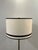 Modern stylish Currey & Co. Gieves Floor Lamp. Black banded shade with black base and gold accents. Original retail $1640....