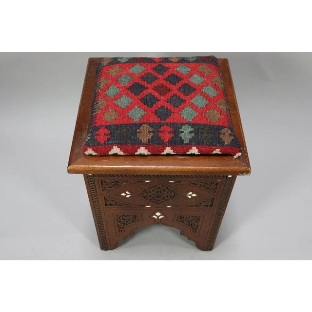 This is very beautiful and incredibly ornate Islamic stool. The stool is in a warm walnut and is decoratively carved . The...