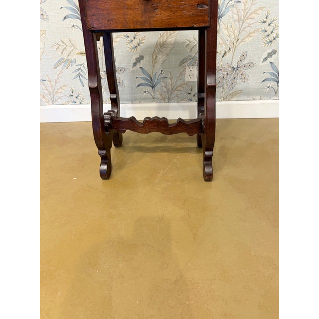 This is an Italian dark wood accent able with single deep drawer and turned accent legs. It is loaded with rich wood...