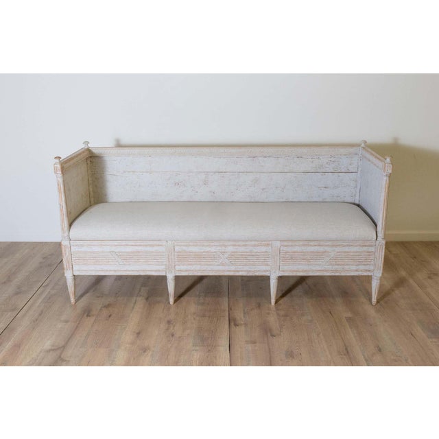 A stunning 19th-century Swedish sofa, circa 1800, crafted in the neoclassical tradition. This elegant piece is constructed...
