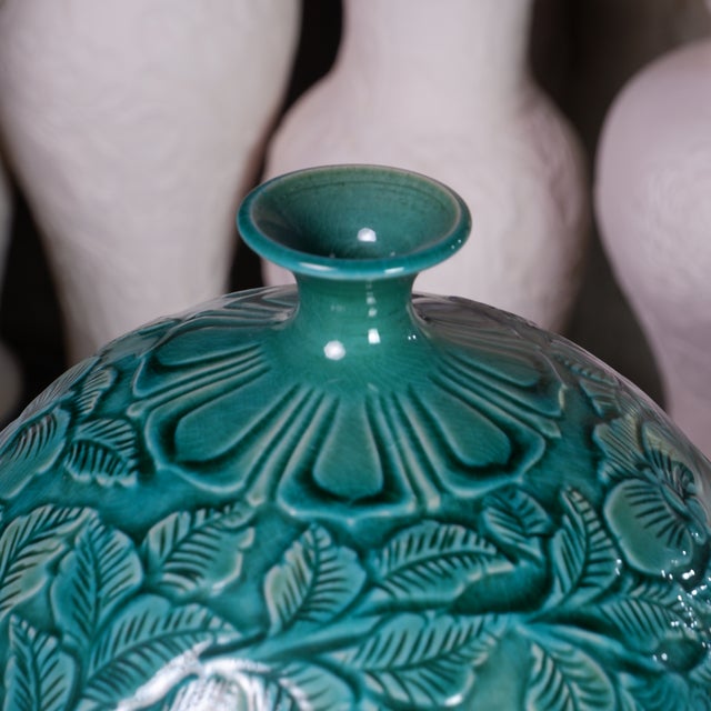 This exceptional vase is handcrafted by Pottery 12, an acclaimed artisan ceramic studio in Hanoi known for its sculptural...