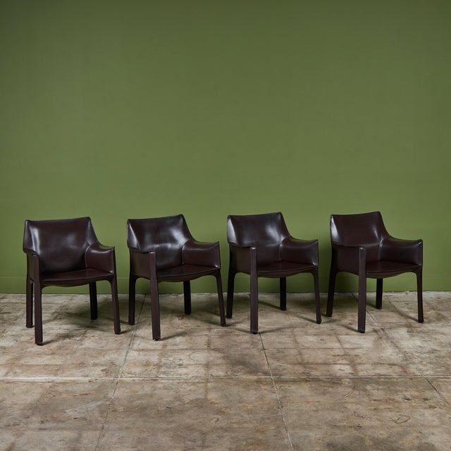 An iconic set of four armchairs designed by Mario Bellini for Cassina c.1970s, Italy, feature the original rich brown...