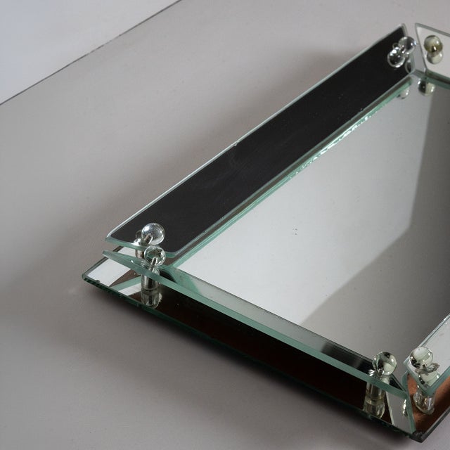This elegant Art Deco Vanity Tray originates from the United States, Circa 1935. Composed in cut and beveled mirror glass,...
