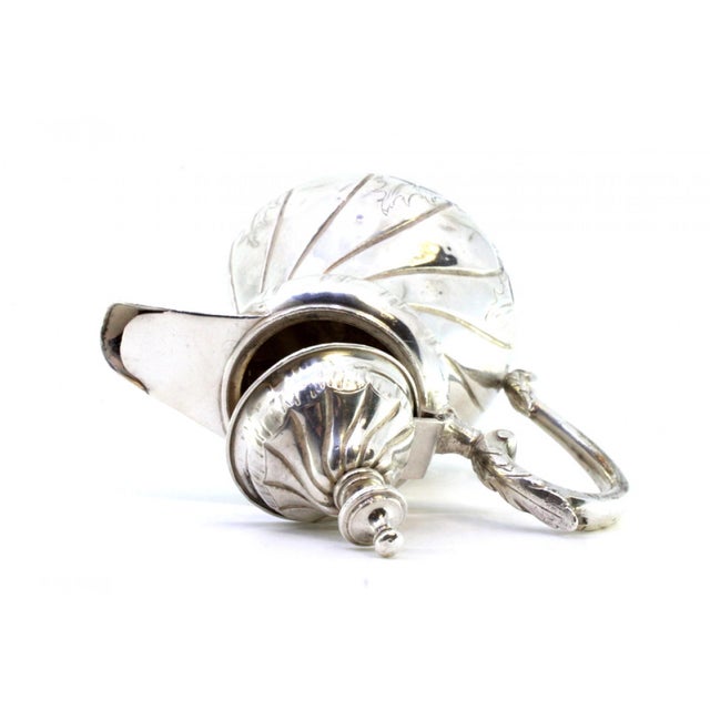 Silver Coffee Pot with Engraved Gummed Friezes, in Very Good conditions. Designed 1890 to 1919 This piece has an...