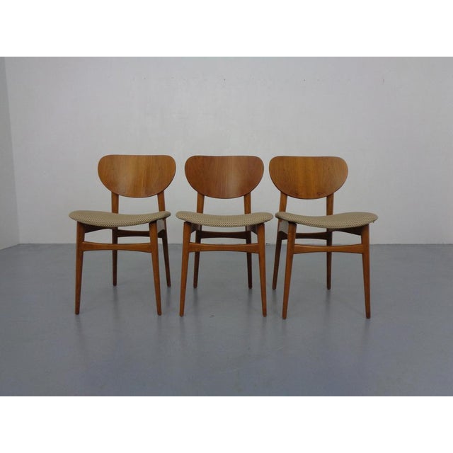 Set of three dining chairs produced in the 1960s.