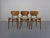 Set of three dining chairs produced in the 1960s.