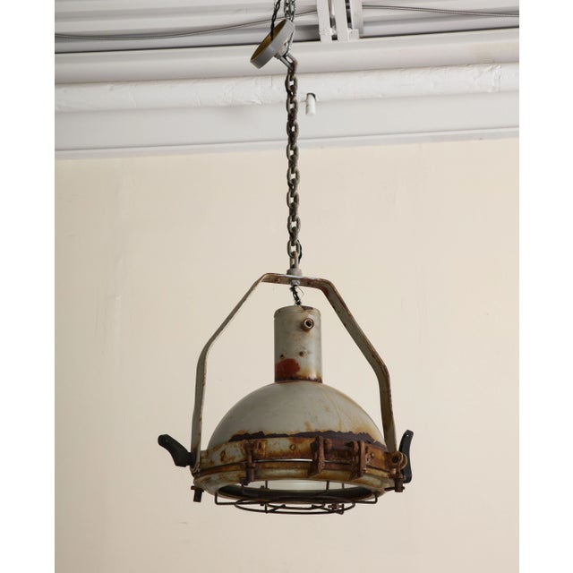 Vintage Industrial Pendant Light, c. 1950. Distressed patina with rust as shown. Wired for USA, good working condition....