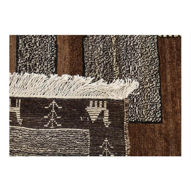 A modern Persian Shiraz small throw rug handmade during the 21st century with a pictorial design of a male lion in redover...