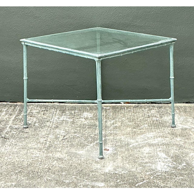 Elevate your outdoor sanctuary with this sophisticated cast aluminum side table, meticulously designed in the iconic...