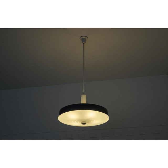 A set of large mid century pendant lamp in painted metal and etched opaline glass 1960. A large (62 cm / 25 inch diameter)...