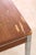 Mid Century Modern mahogany veneer table leaning into the Minimalist aesthetic. Steel chrome legs and chrome trim contrast...