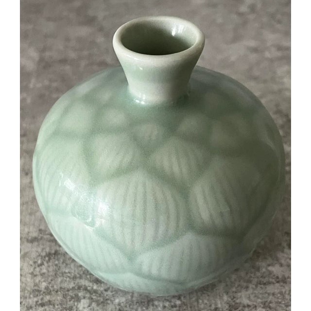 Celadon bud vase from the 20th century Song Dynasty. A beautifully made piece of history, the glaze is perfect, as is the...