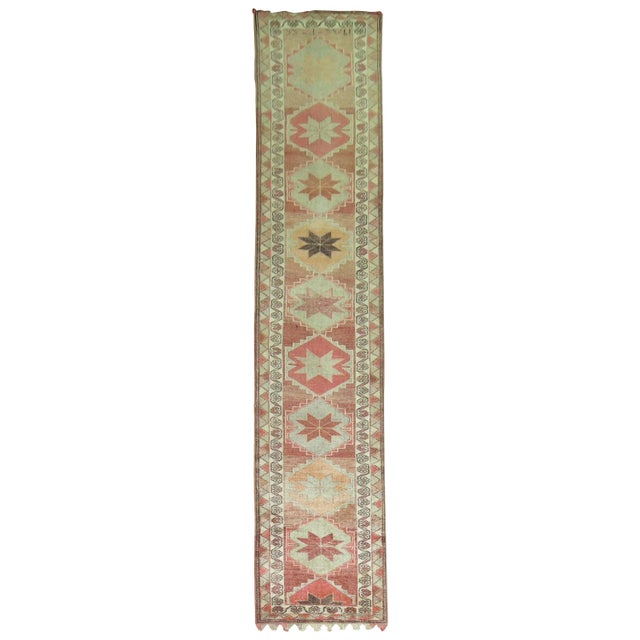 A mid-20th-century Turkish geometric runner in earth tones Measures: 2'10" x 13'10''.