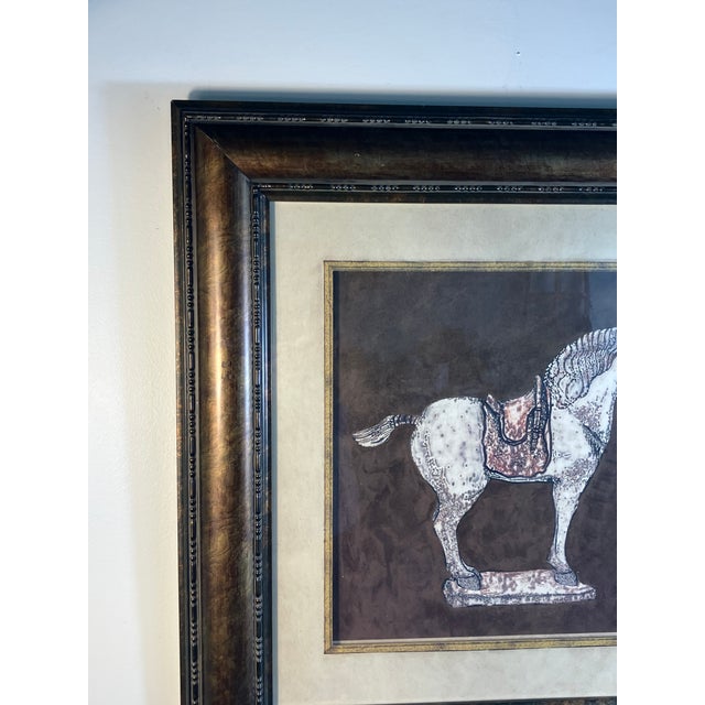 Signed decorative print by Carolyn Kinder, featuring a Tang Dynasty-style horse with a detailed saddle and finely rendered...