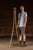 Oak floor-standing coat rack featuring a four-sided central standard fitted with cast metal double hooks arranged at...