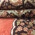 Antique handwoven Tabriz rug featuring a central medallion on a terracotta field. Minor age wear, low pile.