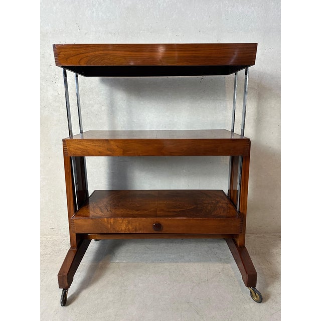 Original Art Deco rack or table in burr wood. Marked: Besway - England. Metamorphic piece of furniture. It can be...