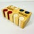 A vintage poker chip caddy with chips in three colors. There are approximately 24 chips in each of the eight slots for...