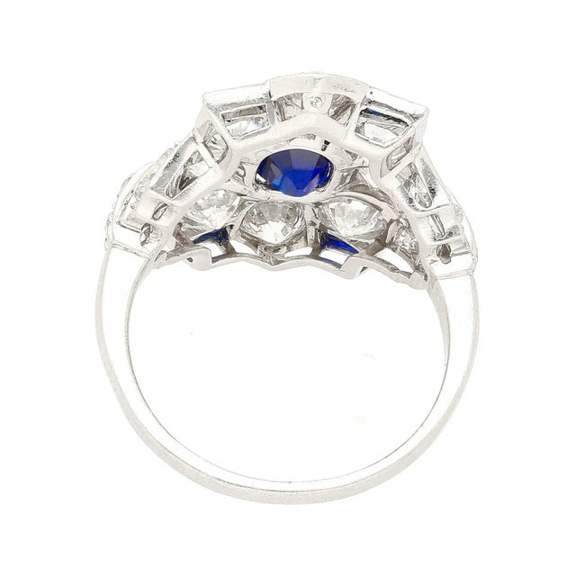 This is part of Chairish’s Fine Jewelry assortment. AGL certified 1.27 carat cushion cut no heat blue sapphire and old cut...