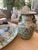 A charming pair of porcelain decorative vases in the loveliest shade of green, these whimsical pieces are full of...
