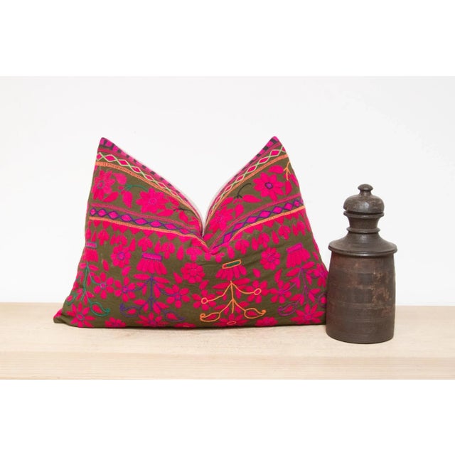 A lovely hand-embroidered pillow made from vibrant vintage tribal skirts coupled with a new linen back. This intricate...