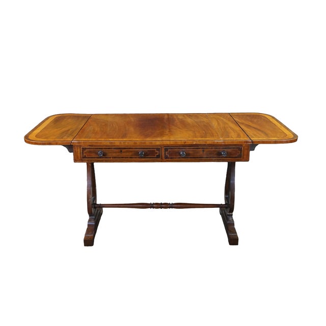 This exceptional antique English Regency drop-leaf sofa table, writing desk or library table showcases premium early 19th-...