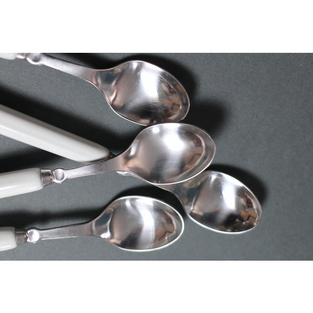 Individually priced. Wonderful design of flatware with a ceramic handle in white, orange red, and brown. Mushroomed at the...