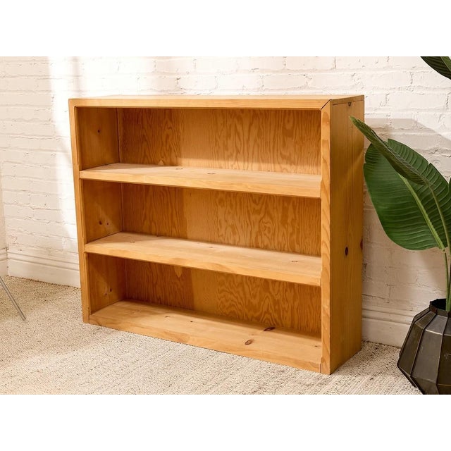 A handsome vintage open bookshelf crafted in warm oak, with a straightforward, substantial silhouette that lets the...