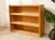 A handsome vintage open bookshelf crafted in warm oak, with a straightforward, substantial silhouette that lets the...
