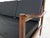 Wooden sofa with black vinyl upholstery. Wooden sofa with six cushions with black vinyl upholstery. Two springs are a...