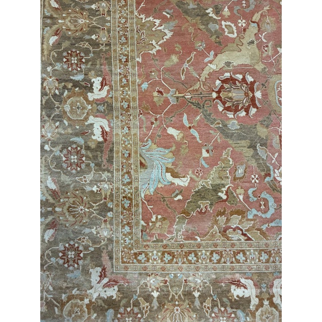 Elevate your space with this beautiful hand-knotted Persian Tabriz-style area rug, showcasing an elegant allover floral...