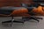 The Eames Lounge Chair and ottoman are furnishings made of molded plywood and leather, designed by Charles and Ray Eames...