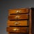 This petite Biedermeier miniature chest of drawers exudes charm and elegance. Crafted from walnut wood, it features four...