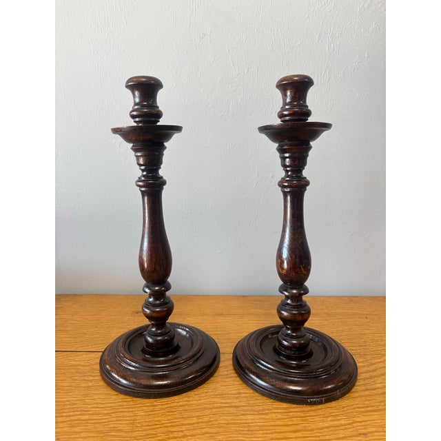 This pair of vintage English oak candlestick holders carries the quiet poetry of evenings lit by flame rather than switch....