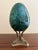 A stunning Russian style monumental malachite egg on Neoclassical style brass stand featuring three dolphins Late 20th...