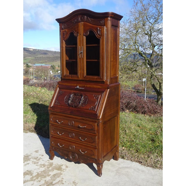 Elegant and space-saving 3-in-1 piece of furniture offering ample storage: chest of drawers, secretary desk, and display...