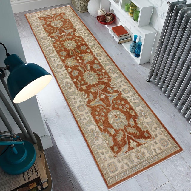 Enhance the ambiance of your home with this magnificent Persian-influenced Turkish hand-knotted rug made by skilled...
