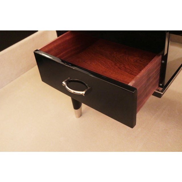 A fine Art Deco Ambassador desk Designed by De Coene Frères. A partner desk with bowed front and back Black lacquer with...