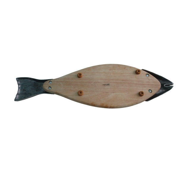 This salmon shaped serving trencher board combines rustic charm with artistic design. Crafted from durable wood with a...