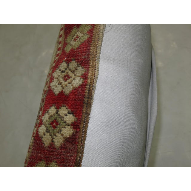 Pillow made from a border of an old turkish rug . Each of our pillows include an polyfill insert and zipper closure