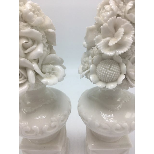 So delicate and lovely, this pair of perfume bottles mimic topiary stands with floral arrangements.