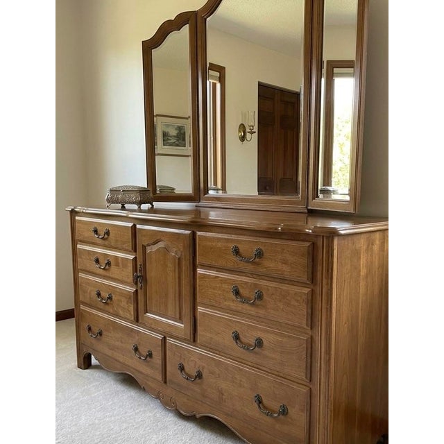 Elevate your bedroom with the timeless elegance and heirloom-quality craftsmanship of this stunning vintage Ethan Allen...