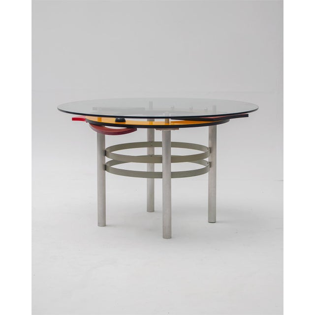 Abstract funky postmodern dining table. Spectacular design featuring multiple layers of lacquered wood. Mounted on a metal...