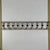 Architectural salvaged wooden balustrade/railing portion in its original white paint with red knots for the hourglass...