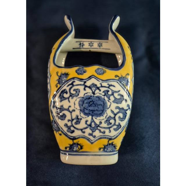 A striking Chinese export porcelain handled basket vase from the early 20th century / Republic Period. This eye-catching...