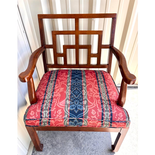 Stunning set of mahogany Chinese Chippendale wood fretwork upholstered armchairs. They are in impeccable condition with...