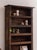 Splendid primitive cabinet in solid Swiss pine with five shelves. Organic shape with decorative frames. Recovered in...