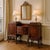 An antique Chippendale-style mahogany sideboard with carved floral details, egg-and-dart trim, and elegant claw-and-ball...